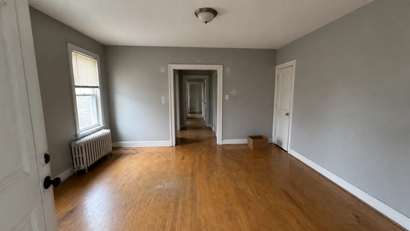 Before: Before and after comparison of an empty apartment room furnished with clear door circulation