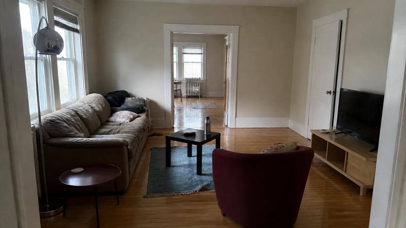 Before: Before and after room redesign showing related but not identical sofa, rug, table and lamp categories