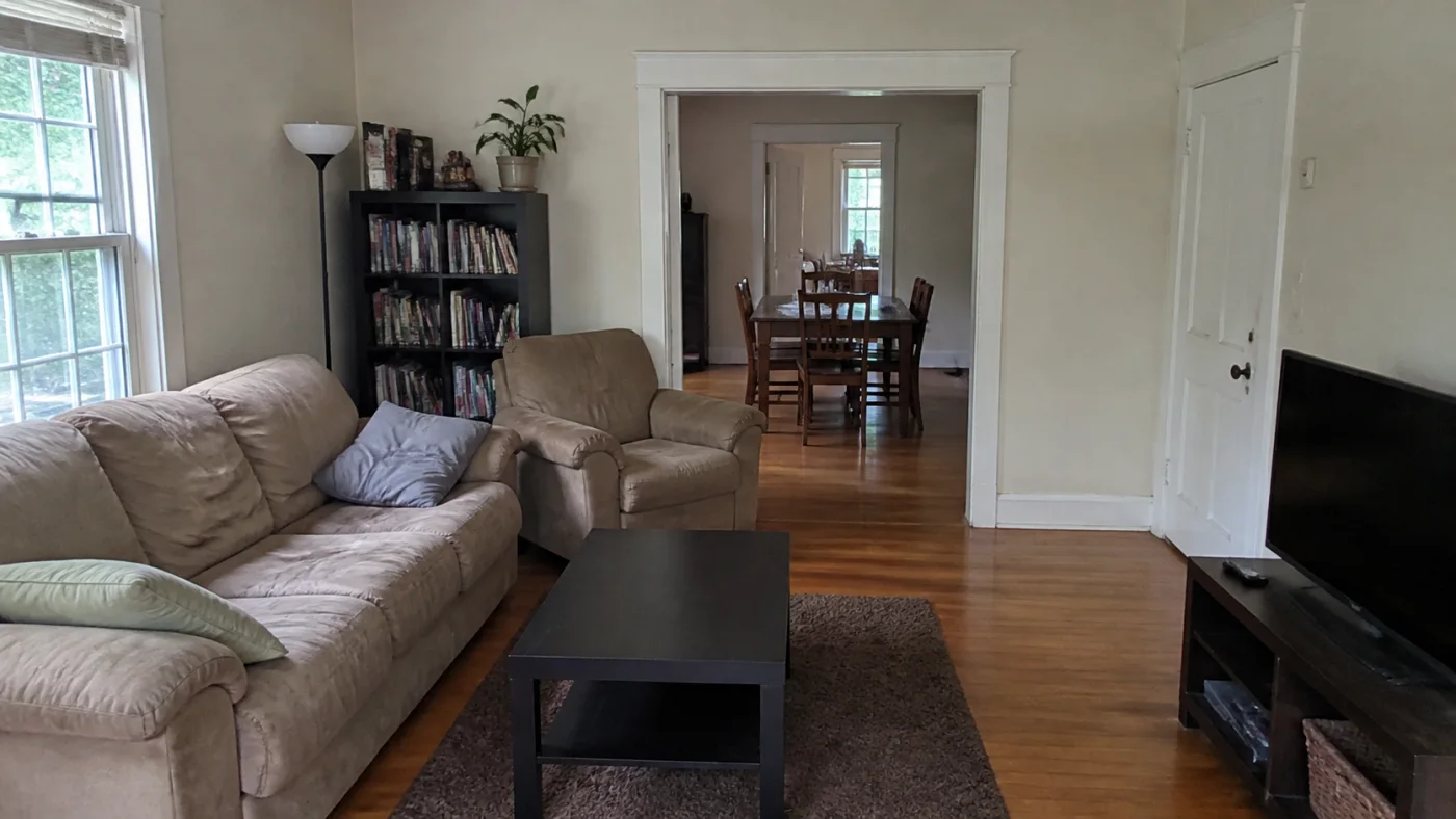 Before: Before and after comparison of an ordinary living room and a restrained mid-century modern redesign